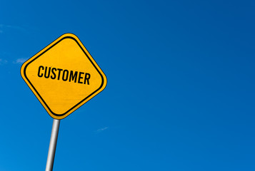 customer - yellow sign with blue sky