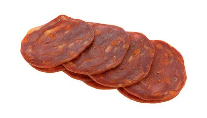 Several slices of pork sausage luncheon meat on a white background.