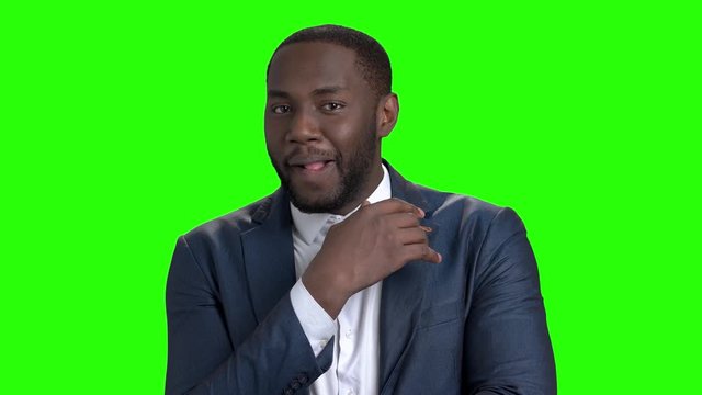 Seductive afro american macho man. Portrait of handsome dark-skinned sexy man on chroma key background. Seduction and lust concept.
