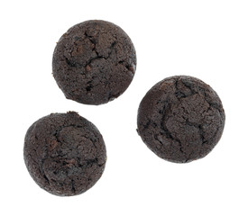 Top view of three bite size chocolate muffins isolated on a white background.