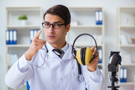 Safety doctor advising about noise cancelling headphones