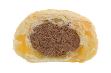 Chocolate creme horn piece on a white background.