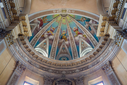 Detail of the ceiling of a chapel with painted angels.