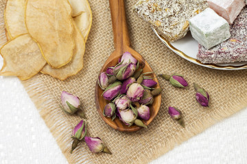 Image of tea made from buds of roses and Turkish sweets