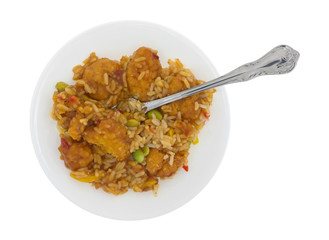 Top view of a chicken nugget TV dinner on a plate with a fork isolated on a white background.