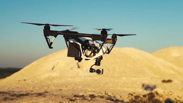 Drone flies over the hills