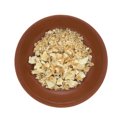 Cracker crumbs in a small bowl on a white background.