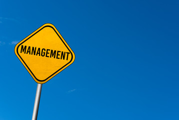 management - yellow sign with blue sky