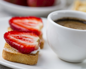 Toast with fresh strawberry and coffee