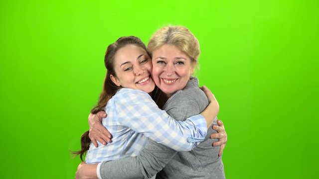 Native hugs, they are stand and talking. Green screen