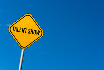 talent show - yellow sign with blue sky