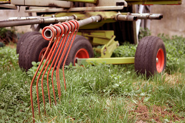 Old agricultural machine with rust on it, rustic farm equipment