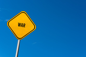 war - yellow sign with blue sky