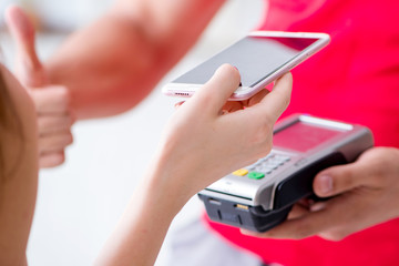 Concept of paying with POS terminal