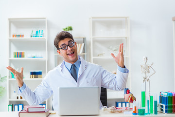 Funny doctor having fun in hospital lab