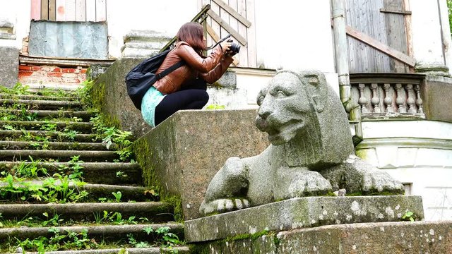 girl collects photographic material in the historic ruins