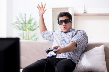 Man playing 3d games at home