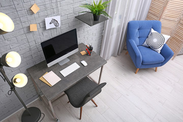 Modern home office interior, view through CCTV camera