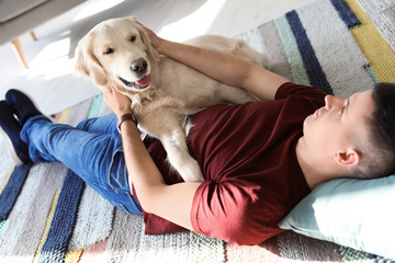 Portrait of owner with his friendly dog at home