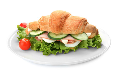 Tasty croissant sandwich with sausage on white background