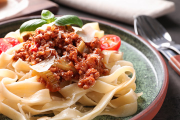 Plate with delicious pasta bolognese, closeup