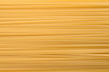 Uncooked pasta as background, closeup