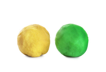 Fototapeta premium Colorful play dough on white background