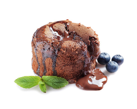 Delicious fresh fondant with hot chocolate and blueberries on white background. Lava cake recipe