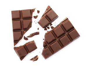 Delicious black chocolate on white background, top view