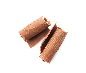 Delicious milk chocolate curls on white background
