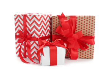 Beautifully decorated gift boxes on white background