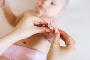 Massage of arms of the baby
