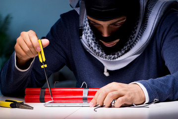 Terrorist bomber preparing dynamite bomb