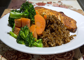 seh seafood dinner of baked salmon brown rice broccoli carrots