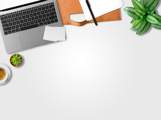 Flat lay of modern laptop workspace office of freelance with coffee cup waffles and document papers.