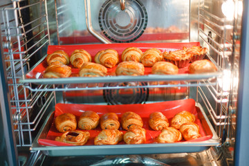 French sweet pastries in a professional oven - 205711392