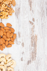 Nutritious different nuts containing vitamins, natural minerals and fiber, healthy nutrition, copy space for text