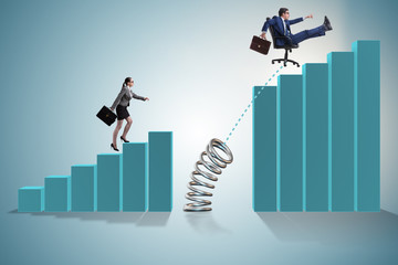 Business people jumping over bar charts