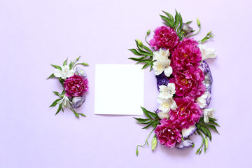 festive floral composition of peonies on pink and purple background .