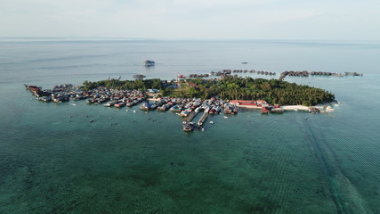 Fototapeta na wymiar Mabul Island, Malaysia. Islands like this are at risk from climate change and rising sea levels 