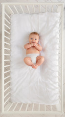 Baby in a cot - 205714923