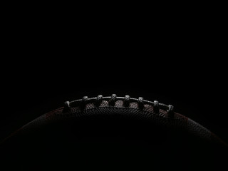 Laces of an American Football Game Ball Lit from Overhead