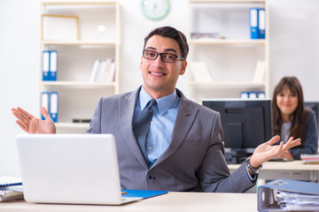 Man and woman working in the office