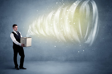 An illustrated powerful whirlwind escaping, coming out of empty paper box held by elegant...