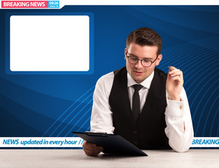 Television reporter telling breaking news at his studio desk with copy space concept