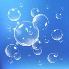 Realistic soap bubbles with reflection set isolated vector illustration. Blue background