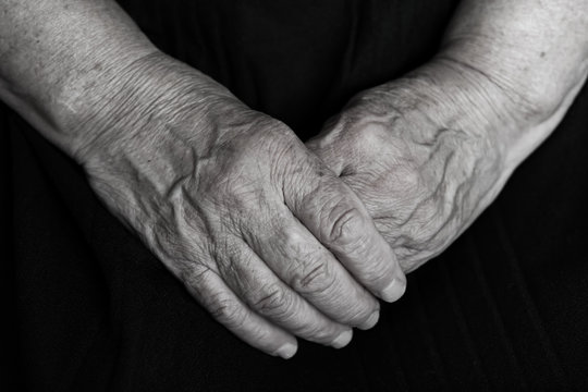 Old woman's hands, grandmother's hands, close-up, concept time, generational change black and white
