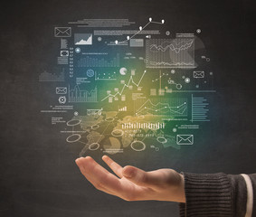 Demographic related charts, diagrams and graphs hovering over young hand