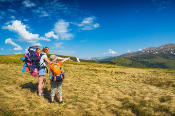 Family of hikers on a trekking day in a valley
