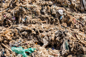 MUKDAHAN PROVINCE, THAILAND-MARCH 1: Plastic and Other Waste in Municipal waste disposal open dump process.  Dump site at Mukdahan Province on MARCH 1 , 2016 in MUKDAHAN PROVINCE THAILAND